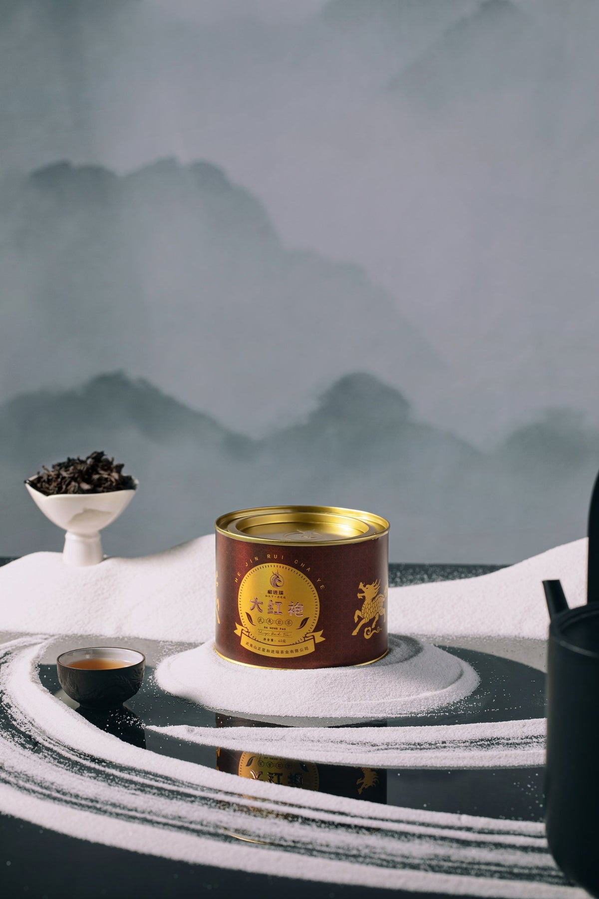 Red Robe tin against misty Wuyi mountain backdrop