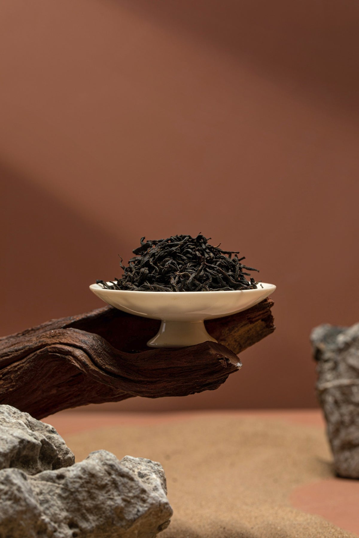 Lapsang Souchong dry leaves on porcelain pedestal