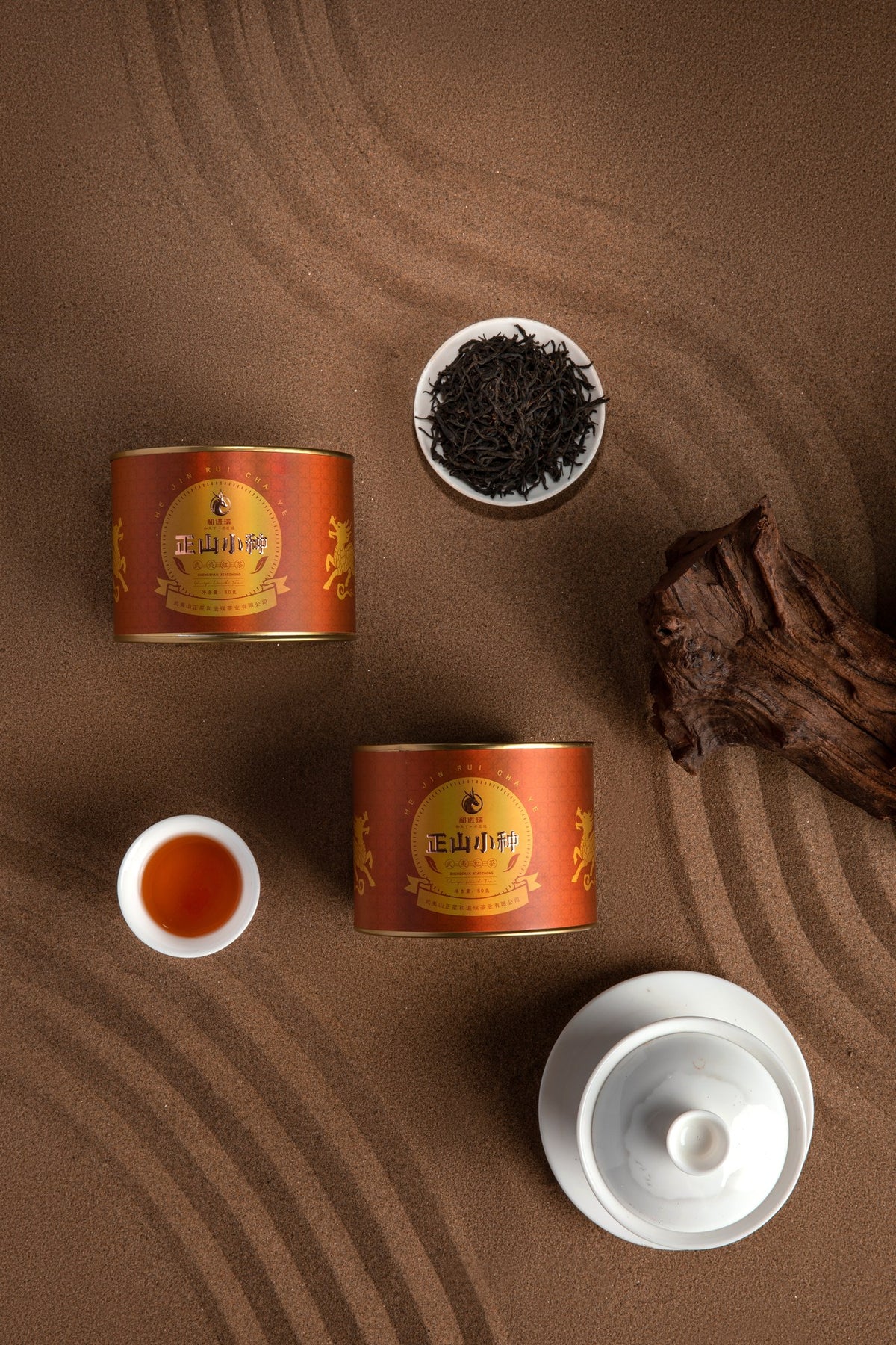 Lapsang Souchong tins, leaves and gaiwan — top view